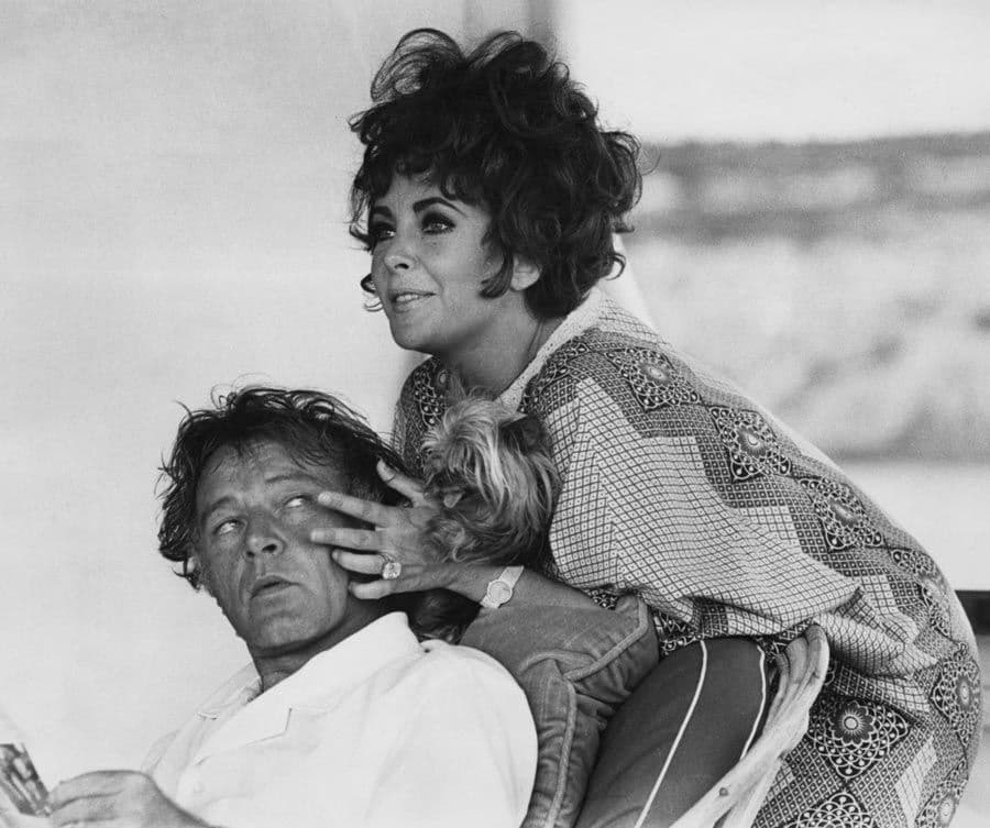 Elizabeth Taylor and her husband, actor Richard Burton on their yacht 'Kalizma' off Capo Caccia on the coast of Sardinia, August 1967. They were both there for the location filming of 'Boom' by Tennessee Williams. (Photo by Express/Hulton Archive/Getty Images)