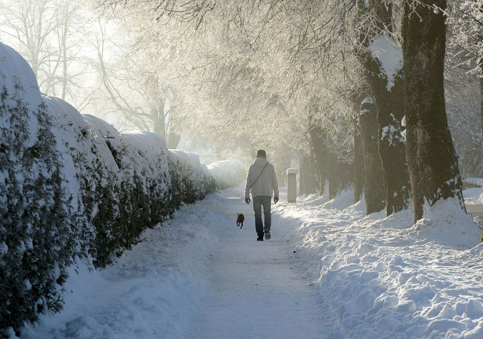 man walking in snow, winter depression