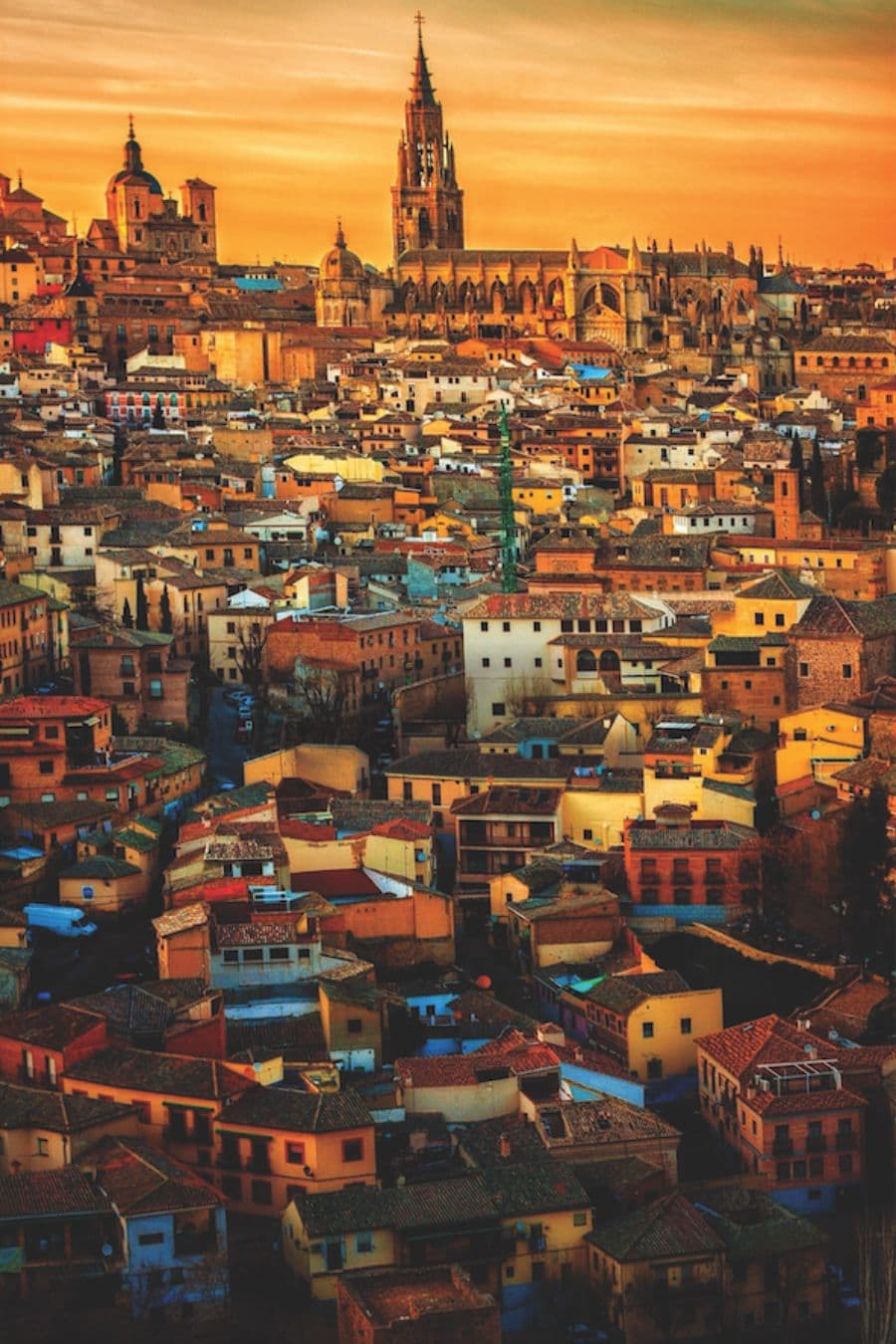 A picture overlooking Madrid, Spain under a bright orange sky.